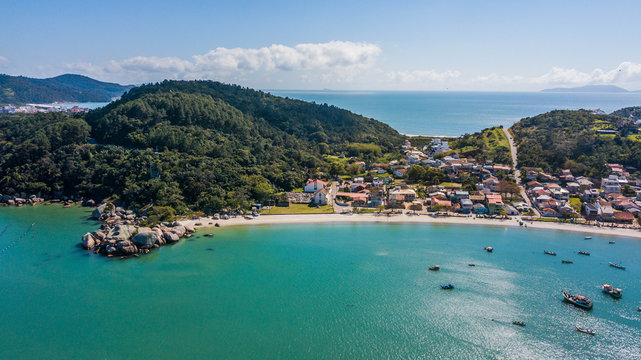 Aerial view of Armação da Piedade beach (Praia da Armação da Piedade) - Governador Celso Ramos. Historical and beatiful beach in Santa Catarina, Brazil © Jair