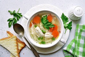 Chicken soup with vegetable. Top view with copy space.