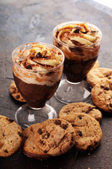hot chocolate with cocoa and whipped cream on rustic background