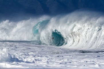 Surfer inside a giant wave