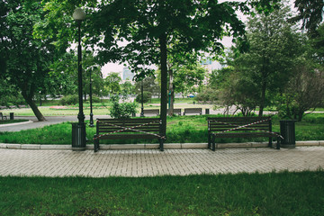 closed park in Moscow, benches wrapped in red ribbon, no seating, quarantine 