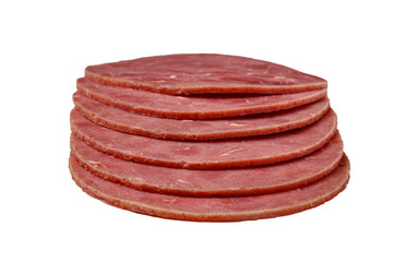 Sliced sausage slices lie on a white background. Isolated.