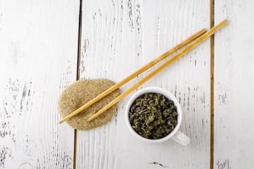 Green tea in a white cup.