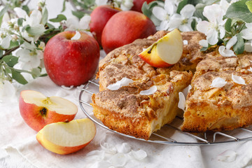 Board with delicious apple pie on table
