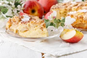 Board with delicious apple pie on table