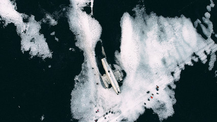 plane wreck on the snow and black sand