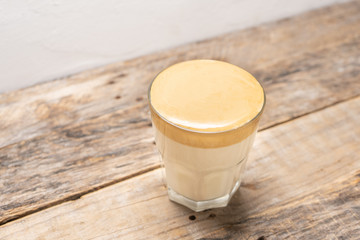 Korean dalgona coffee on wooden background