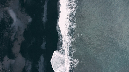 Black sand beach and waves