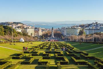 View of Parque Eduardo VII in Lisbon, Portugal, on a beautiful winter sunny day, with castle on the...