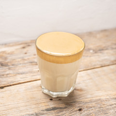 Korean dalgona coffee on wooden background