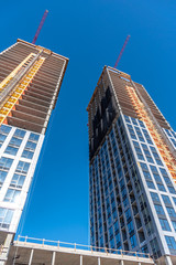 Obraz premium Condo towers under construction in the city of Calgary.