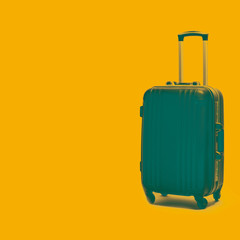 Stylish suitcase on a colored background. Collage in the style of art.