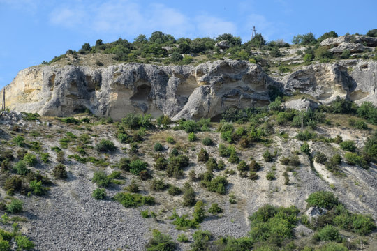 Limestone cliffs with sample of material, limestone erosion in the rocks.