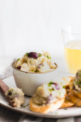 Cod fish brandade on a white ceramic and rustic napkin