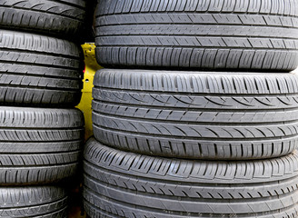 Rubber automotive tires with new treads stacked on each other