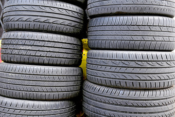 Rubber automotive tires with new treads stacked on each other