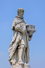 Fototapeta na wymiar Marble statue of Andrea da Recanati in Prato della Valle in Padua, Italy.