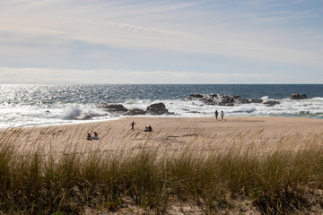 People on the beach enjoying the first hot days, relaxing from Covid-19 pandemic.