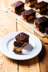 freshly baked brownie on a rustic wooden background