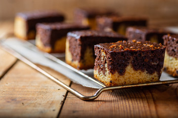 freshly baked brownie on a rustic wooden background