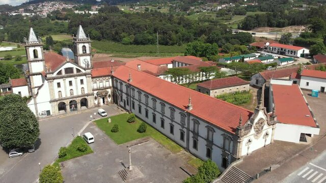 AERIAL DRONE FOOTAGE - The Monastery of St. Benedict (Sao Bento) in the city of Santo Tirso, Portugal, with the Ave River in the background. The Municipal Museum Abade Pedrosa.