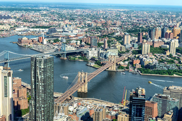 Obraz na płótnie Canvas Manhattan aerial View with its bridges, Brooklyn Bridge and Manhattan Bridge