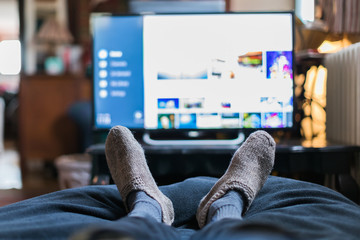 view of feet and television from first person view