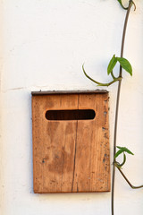Wooden box to receive old-fashioned letters at the front door of the house North of Thailand