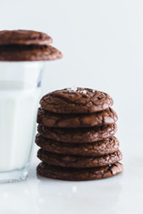 chocolate brownie cookie with glass of milk