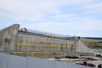 Fototapeta premium Reinforced concrete construction road junction. Road construction and bridges.