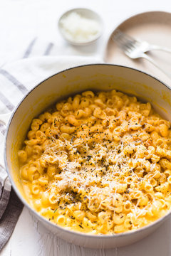 Pumpkin Mac And Cheese On A White Background And Rustic Dish And Napkin