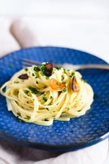 Aglio e Olio pasta in a blue ceramic