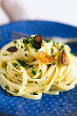 Aglio e Olio pasta in a blue ceramic