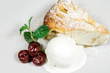 Ice cream dessert with cherries and herbs