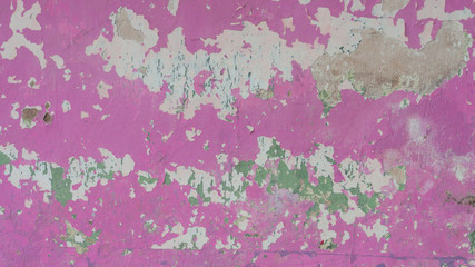 Pink color wall with cracks in several parts, the picture is suitable to be used as a background image, wallpaper, or graphic resource