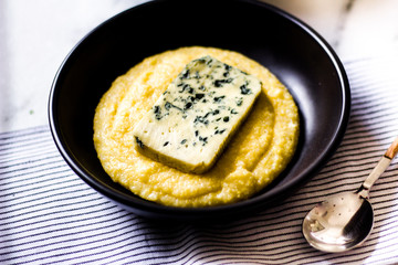 Polenta with blue cheese and black ceramic