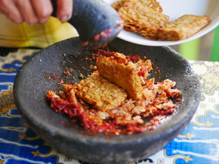 Making sambel tempeh. The tempeh chili flavor is very tasty and fragrant soybean. Delicious to eat with side dishes and warm rice.