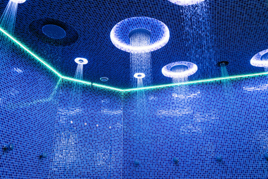 Ceiling in a blue shower room with dynamic LED lighting