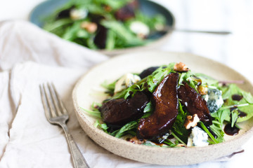 Pear salad with balsamic vinegar nuts and arugula