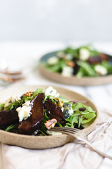 Pear salad with balsamic vinegar nuts and arugula