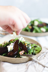 Pear salad with balsamic vinegar nuts and arugula