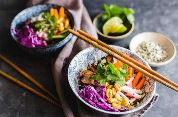 Homemade rice noodles salad with radish, carrot, red cabbage cilantro