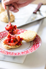 strawberry shortcake with cream on a cute plate