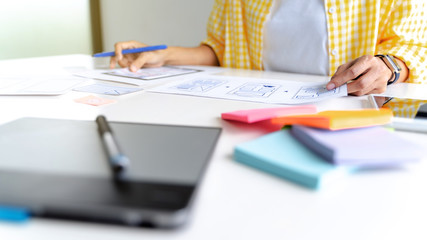 Web programmer discussing in prototype application management.