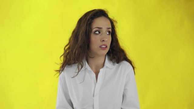 Young woman is worry and rubbing her hands
