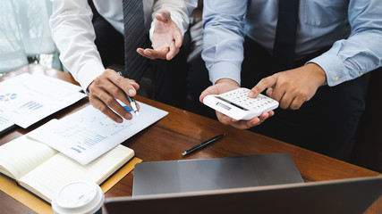 Business executives cooperation in sale data performance report.