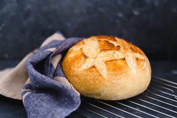whole sourdough bread with napkin