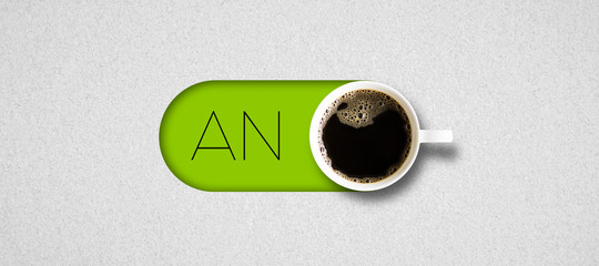 cup of coffee and German text for ON on bright paper background