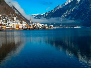 blue lake, snow mountain and beautiful town
