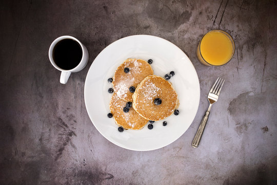 Stack Of Blueberry Pancakes On  A Concrete Background